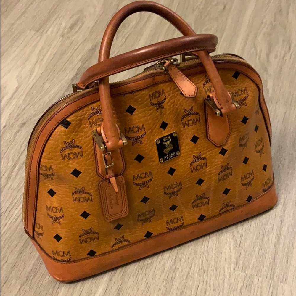 2 Authentic MCM medium heritage bowler purse